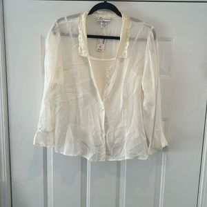 Pretty cream color blouse with shell, lace and pearl buttons